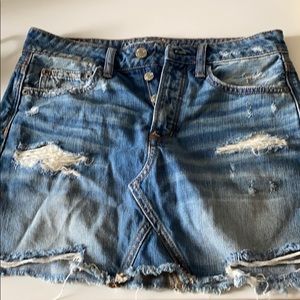Blue ripped jean skirt